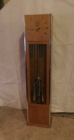 Vintage Mid Century Modern Oak and Chrome Pendulum Grandfather Clock in the style of George Nelson for Howard Miller
