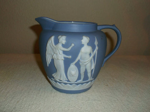 Blue and white pitcher with greek figures