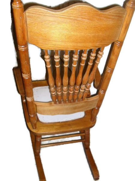 Early twentieth century press back oak wood rocking chair