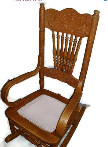 Early twentieth century press back oak wood rocking chair